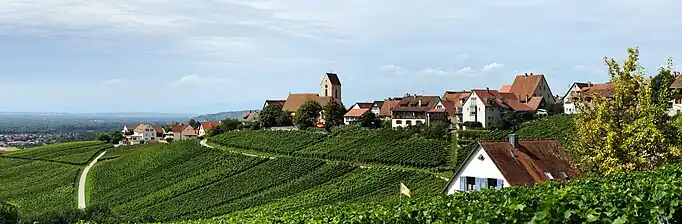 &nbsp;Panoramic view of Ötlingen from the southeast; the hilly landscape is typical for the region of Markgräflerland