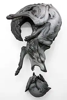 Title: "The Question That Devours" Year: 2012 Dimensions: H 64 x W 35 x D 25 in. Materials: Stoneware, paint Installation: Wall Piece