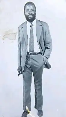 A digitally cropped photograph of Adamson Mushala (in a suit) in 1975.