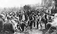 crowd of people with some digging