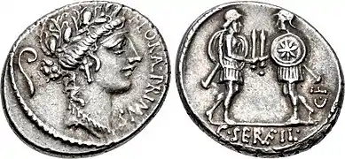 Denarius of Gaius Servilius, 53 BC.  The obverse features the head of Flora with a lituus behind, the reverse the duellists facing each other and presenting swords.  The emblem on the shield of the right soldier could be the Vergina Sun, thus alluding to an event of the Macedonian Wars.