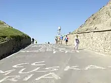 Photograph of a rising road leading to the summit of a mountain
