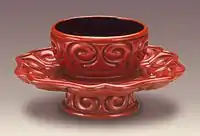 Tuozhan (Cup Stand) in the Form of a Lotus Blossom with Sword-Pommel Pattern, early Ming. Very rounded carving, and a few black layers.