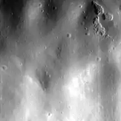 High-resolution image of one of the hollows (upper right) on the east side of the central peak.  The image is about 2.8&nbsp;km wide.