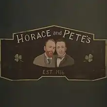 A simple painting of the principal actors leaning next to one another