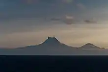Isanotski (8,104 ft; 2,470 m) and Roundtop (6,128 ft; 1,868 m) volcanoes as seen from the Unimak Pass in the morning light.