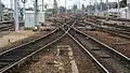 At exit of station (on the left stabling sidings for rolling stock. In the centre lines towards Lille and Paris. On the right locomotive depot.)