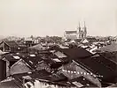 The Sacred Heart Cathedral towering over the one- and two-story homes of old Guangzhou c. 1880