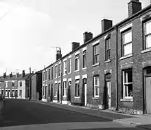 A row of brick-built terraced housing