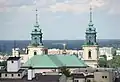 The copper roof and bell towers of the church as seen from the west