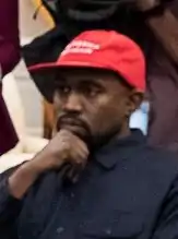 Kanye West wearing a MAGA hat in 2018.