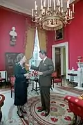 President Ronald Reagan and Prime Minister of the United Kingdom Margaret Thatcher in the Red Room, 1983.