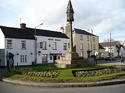 Restored mediaeval cross and Green Dragon Inn,St Thomas Square, Overmonnow