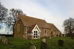 St Wilfrid's Church, Thornton-by-Horncastle, Lincolnshire, general restoration by Ewan Christian in 1890, the timber south porch and timber bell frame in the gable are probably his work