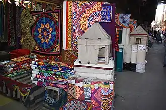 Shops along the Street of the Tentmakers, in the Qasaba of Radwan Bey, selling khayamiya textiles.