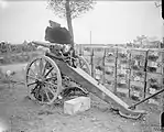 A captured German 5.7 cm Maxim-Nordenfelt gun with destroyed shield. Meaulte-Albert Road after the Battle of the Somme.