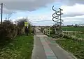 Double helix sculpture where National Cycle Route 11 meets track along Hobson's Brook to Nine Wells