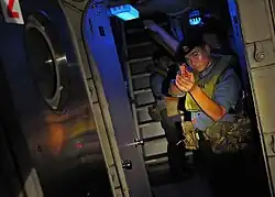 A Royal Brunei Navy sailor watch as passageway aboard USCGC&nbsp;Mellon&nbsp;(WHEC-717) during CARAT 2010.