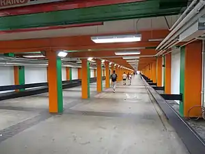 A pedestrian tunnel with brightly painted pillars