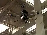 Um drone MIKADO  portando uma câmera no estande da Bundeswehr na CeBIT 2006.