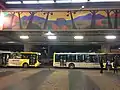 Parte operacional do Terminal Itaquera de ônibus, com destaque para os murais da Série Catedral do Povo
