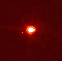 Éris e seu satélite natural visto pelo Hubble