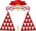 External ornaments of a cardinal's coat of arms, incorporating a scarlet galero with fifteen scarlet tassels on each side and a patriarchal cross behind the escutcheon and the motto