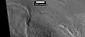 Possível morena na terminação de uma antiga geleira ou montículo em Deuteronilus Mensae, visto pela HiRISE, sob o programa HiWish.  A localização dessa imagem é a legenda A na imagem anterior.