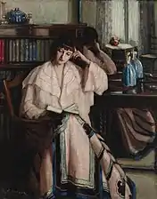 Woman reading (c. 1910)