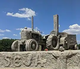 Escultura na entrada de Guzolândia
