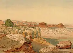 Entardecer no Deserto Kanab. De uma formação do Permiano- Um elevado de rocha Permiana no primeiro plano, rochas escarlates (Vermillion Cliffs) à distância e solo arenoso branco do Jurássico à extremidade no fundo. Grand Canyon, Condado de Mohave, Arizona. (Holmes, 1877)