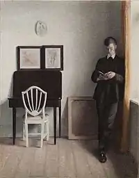 Vilhelm Hammershøi: Interior com Jovem Homem Lendo, 1898