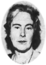 A black and white photograph of a woman's head