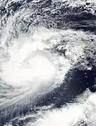 Convection concentrates around the center of circulation and increases, indicating the storm's strengthening trend