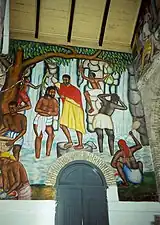 Um mural representando o batismo de Jesus em um típico cenário rural haitiano, Cathédrale de Sainte Trinité, Porto Príncipe, Haiti.
