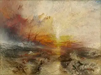 A painting entitled "The Slave Ship" by J. M. W. Turner. In the background, the sun shines through a storm while large waves hit the sides of a sailing ship. In the foreground, enslaved Africans are drowning in the water, while others are being eaten by large fish.