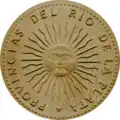 Reverso da primeira moeda argentina com o sol de maio, 1813 (redesenho de 1991)