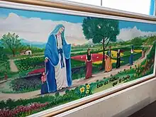 Painel artístico representando o sonho de Amabile com Nossa Senhora.