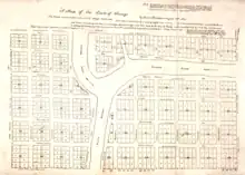 A survey of a 58-block town, trisected into roughly equal parts by the river.