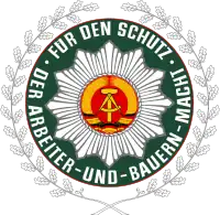 Emblema da antiga Polícia Popular Alemã.