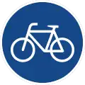 rundes Schild mit weißem Fahrrad auf blauem Grund