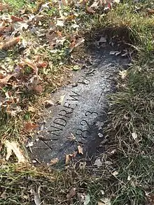 The inground gravestone of Andrew Tainter (1823-1899)