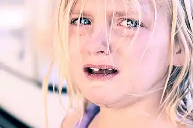 Crying child with blonde hair.jpg