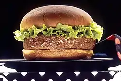 A picture of a hamburger with three buns